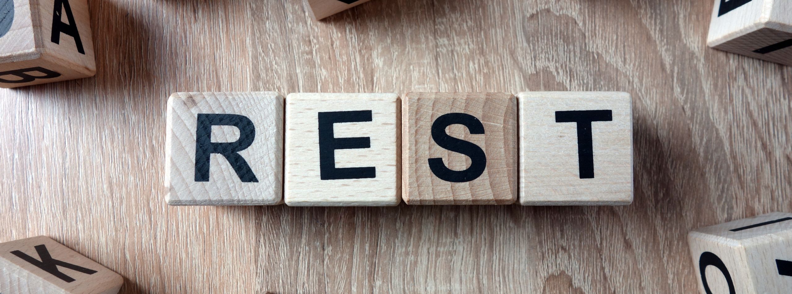 Sabbath rest is important. Rest written in letter tiles.